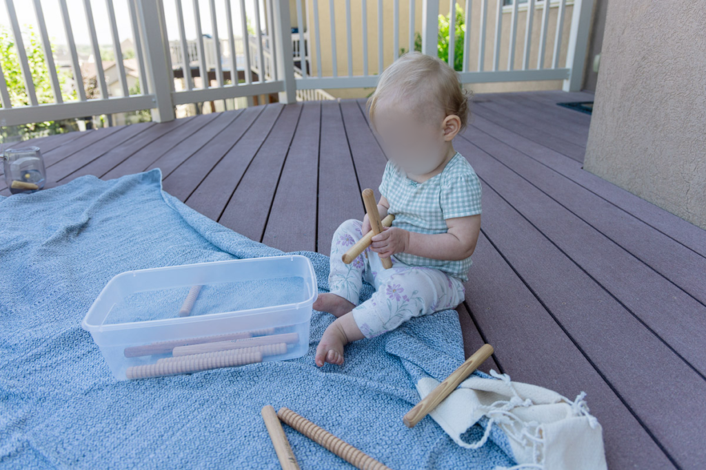 Child playing rhythm stick songs